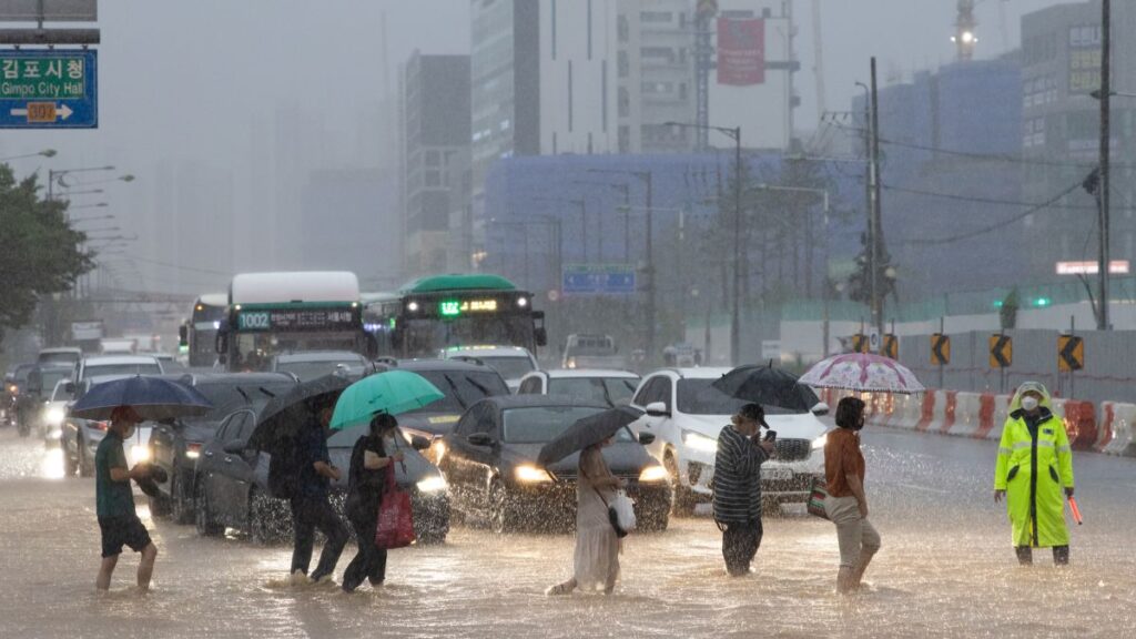 Seven individuals have lost their lives and three are still missing as heavy rains cause flooding in South Korea. The overflowing dam has forced thousands of residents to evacuate their homes.