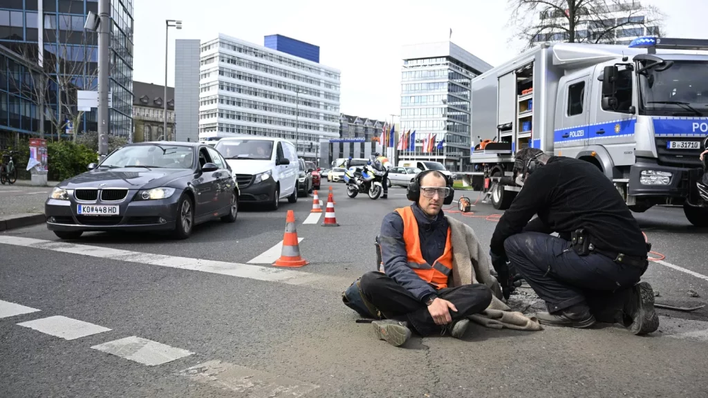 Climate activists glue themselves to roads across Berlin